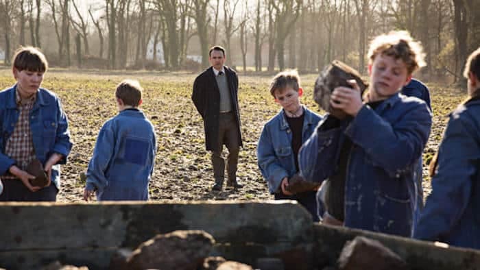 The boys are forced to work in the fields as part of their “education”
